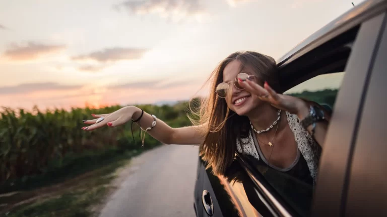 A person sticking head out a window