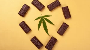 marijuana leaf surrounded by cannabis edibles in the shape of a heart